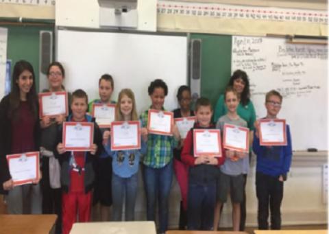 Students pose with their newly earned "EverFi" Financial Training Certificates after completing training offered by Educators Credit Union